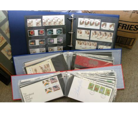 An album containing mint Great Britain postage stamps together with an album of presentational packs and covers and a further