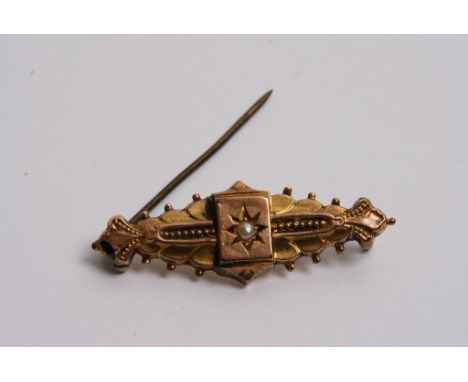 A 9ct gold brooch inset with a single pearl 