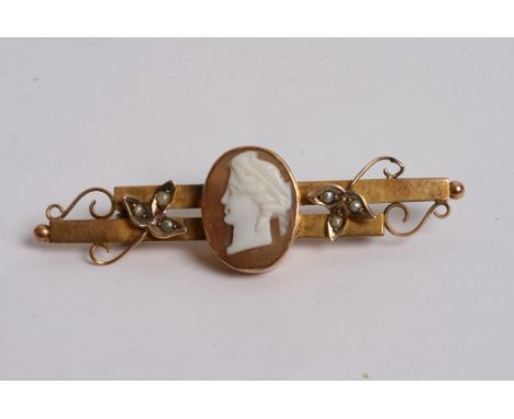 A vintage gold brooch with a small cameo and seed pearl 