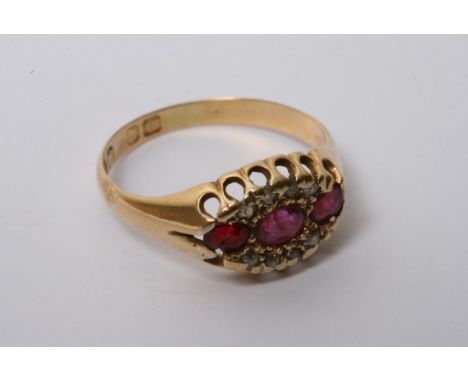 A vintage gold ring inset with Ruby's and chipped diamonds 