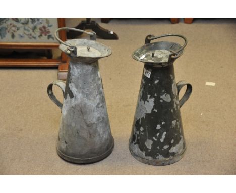A pair of vintage railway water jugs one with embossed B.R., one with S.R. Underneath and old two gallon jug. 