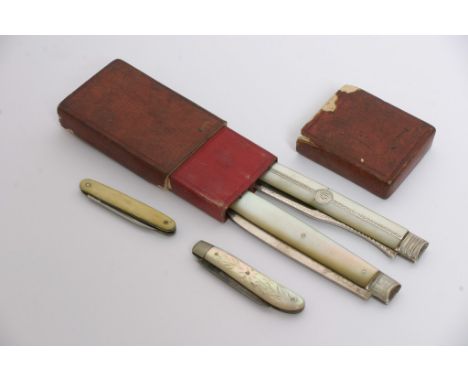 A matched travelling pair,knife and fork in a leather case, the knife with Georgian hallmarks, the fork unmarked with two sma
