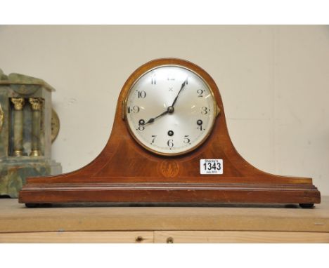 A mahogany mantle clock