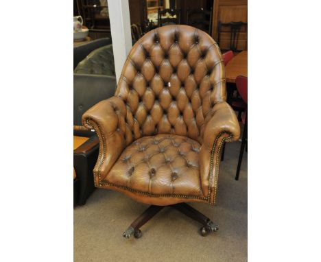 A leather button back office chair