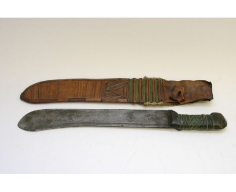 A tribal machete in leather case