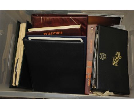 A box containing stamp albums containing unused mint QEII British and commonwealth stamps and various first day covers