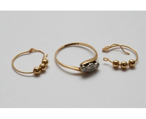 An 18ct gold ring set with a row of diamond chips and a pair of gold hoop earrings