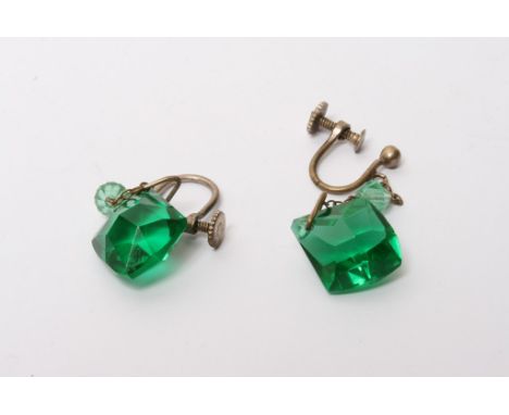 A pair of vintage earrings with large cut green stones 