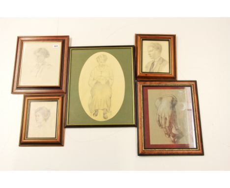 A quantity of framed portrait pencil sketches.