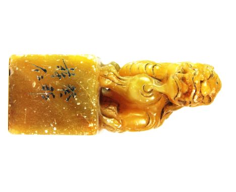 An early 20th century Chinese soapstone seal, H. 10.5cm.