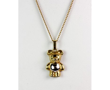 A 9ct yellow and white gold bear pendant and chain (approx. 3.7gr).