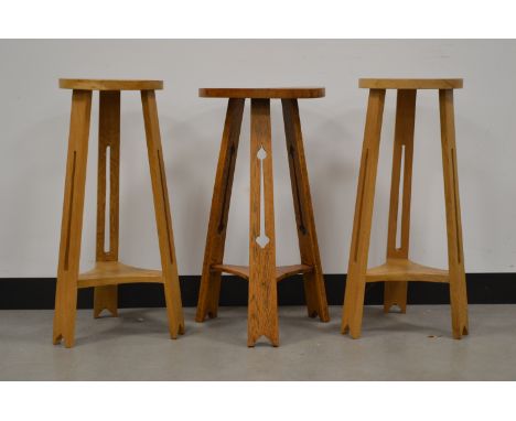Three oak stools, one stained in the arts and crafts style (with repairs) AF and gothic pierced supports, 67cm H x 35cm diame