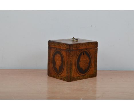 A Regency wooden tea caddy, with painted decoration, the cover with a handle and scalloped decoration, each side with a profi