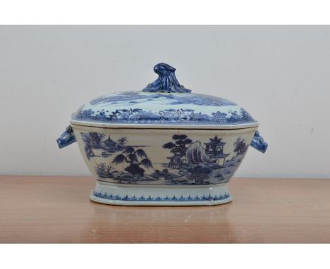A Chinese ceramic twin handled tureen and cover, transferware design, the body cracked and repaired, the handles in the form 