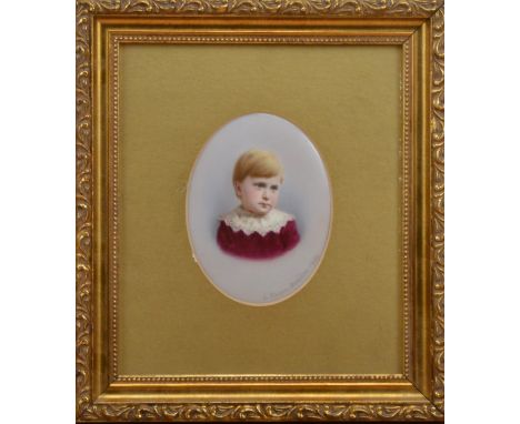 A framed 19th century Dresden ceramic plaque, of a little boy, signed lower right 'L Sturm, Dresden 1888', in a  gilt frame, 