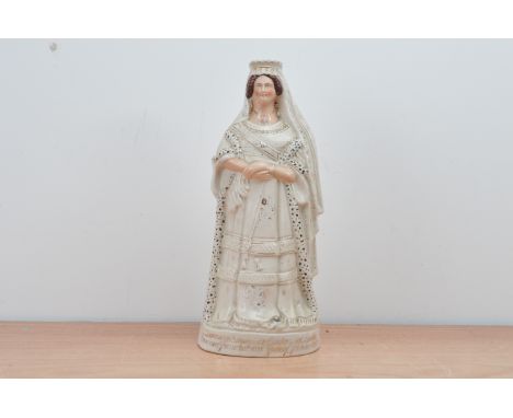 A 19th century Staffordshire ceramic figure of Queen Victoria, commemorating her Golden Jubilee, gilt writing to the base, so