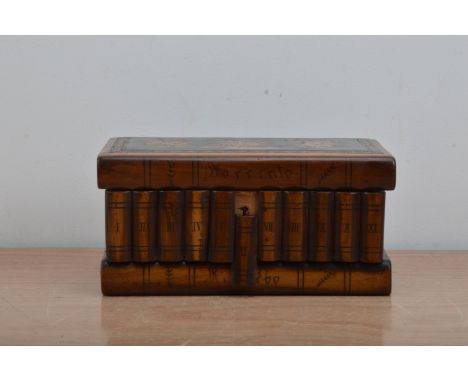 A Sorrento puzzle box, the lid with inlay of flowers and a man on a donkey in a rectangular ebonised panel, 'Sorrento' the ri