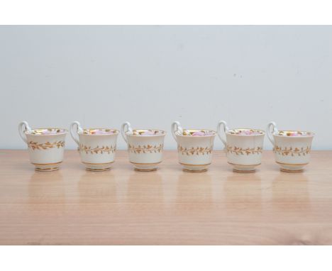 Six early 19th century Spode porcelain tea cups, hand painted floral design with gilt work on a white ground, marked and numb