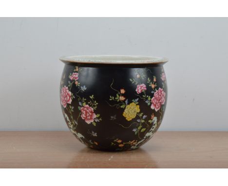 A turn of the century English ceramic planter, black floral 'chinoiserie' glaze, marked indistinctly to the underside, crazin