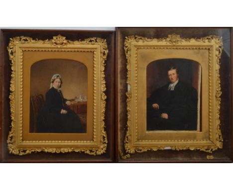 Two painted print portraits, of a man and woman, both in ornate gilt frames, with some damage, within glazed wooded box frame