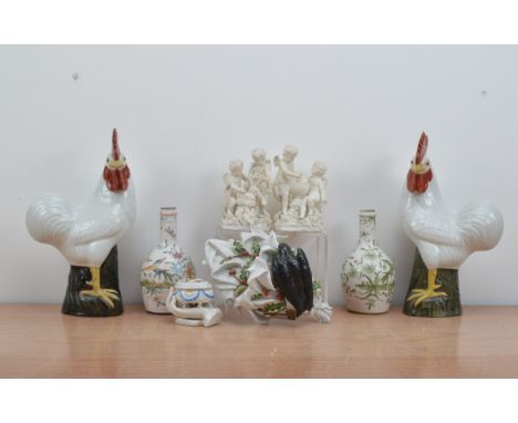 A collection of continental ceramics, comprising a pair of bisque figural groups of cherubs, incised no. 43 &amp; 44 to the b