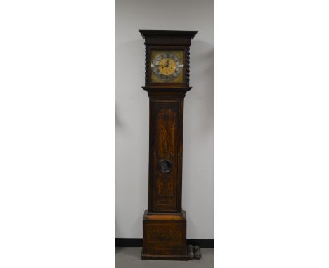 A 19th century longcase clock, mahogany case with inlaid decoration, brass and silvered dial, with Roman numerals and seconda