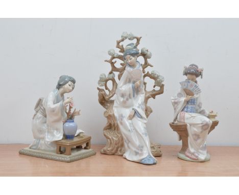 Three Lladro ceramic Japanese lady figurines, the largest a lady with a mirror leaning on a tree (broken and repaired hand) 3
