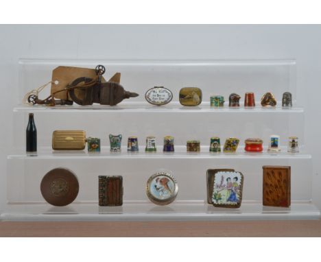 A collection of works of art, comprising novelty boxes, enamel thimbles and ceramic ones, an Indian triple key lock, other sm