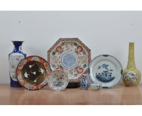 A collection of Chinese and Japanese ceramic items, comprising a vase with a blue glaze and panels with floral decoration, fo