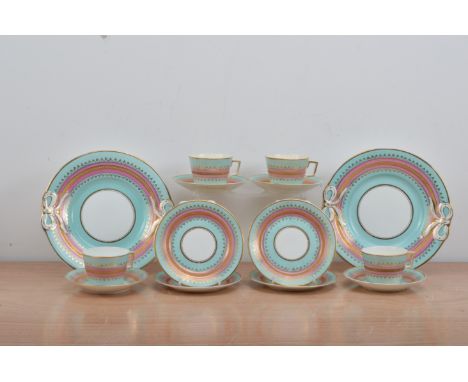 A very decorative turn of the century continental porcelain part tea service,  turquoise and pink glaze with heightened gilt 