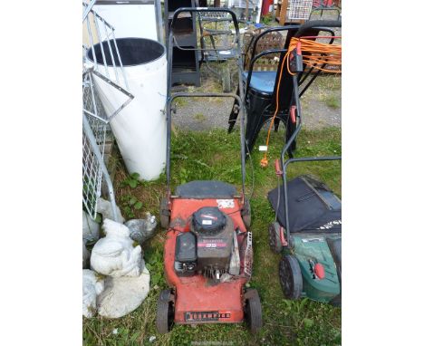 A "Champion" lawn mower with Briggs and Stratton engine, as found.