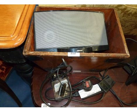 A wooden box with "Bose" speaker unit.