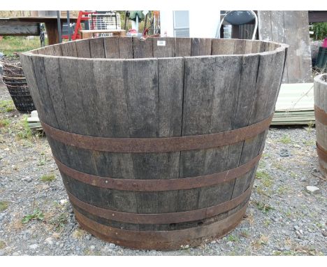 A large half barrel planter 3' diameter x 2' high.