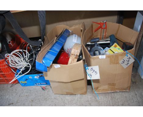 A box of cable, a globe table lamp, grass hook, various cordless power tools, etc.