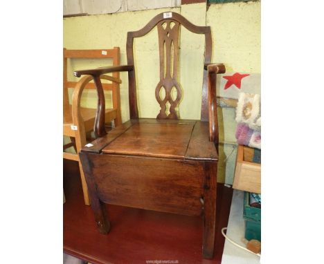 An oak commode chair.