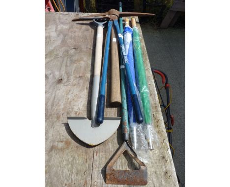 Some garden tools and two umbrellas.