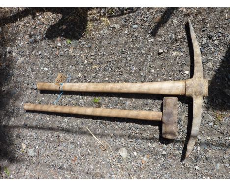 A pick axe and a sledge hammer.