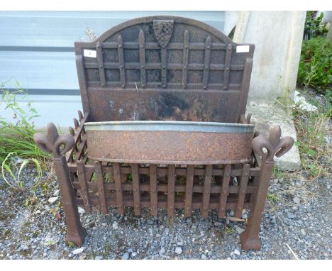 A cast iron fire grate, 22" wide x 14" depth x 23" high.