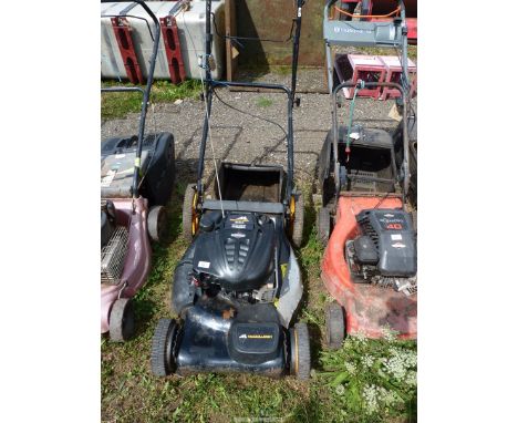 A "McCulloch" lawn mower with Briggs and Stratton engine, good compression.
