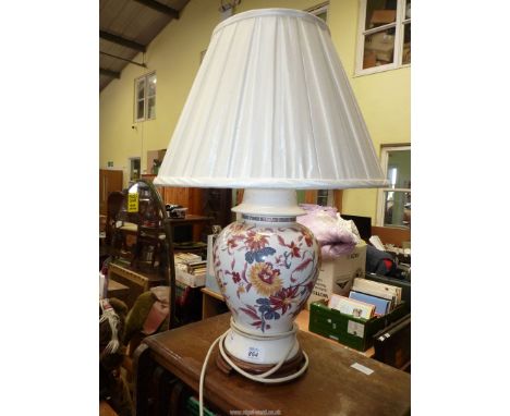 A table lamp with shade.