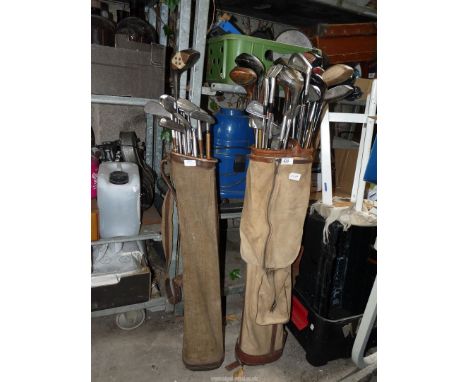 Two vintage golf bags with metal and wooden clubs, one with a Tom Morris Hickory Putter and a Slazenger Ben Hogan.