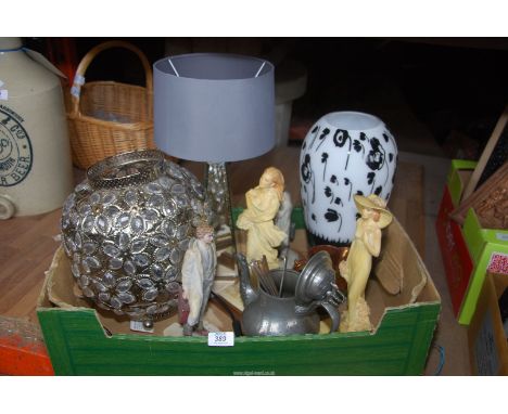 Some light shades, a table lamp, figures, etc.