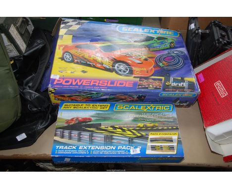 A box of Scalextric and track extension pack.