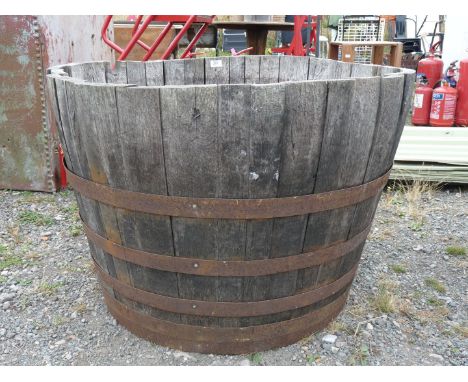 A large half barrel planter, 3' diameter x 2' high.