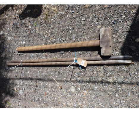 Two crow bars and a sledge hammer.