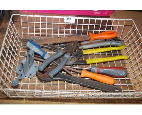 A tray of tools to include: pliers, gate fastener, adjustable spanner, etc.