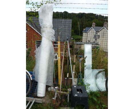 A quantity of garden tools, hardened glass shoe last and a roll of polyethene.