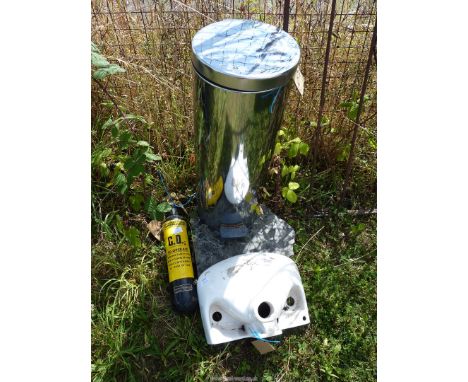 A stainless steel bin, CO2 fire extinguisher and a small hand basin.