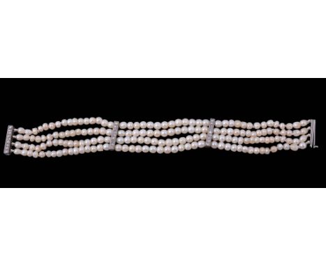 A natural pearl and diamond bracelet, composed of four strands of graduating...  A natural pearl and diamond bracelet,   comp
