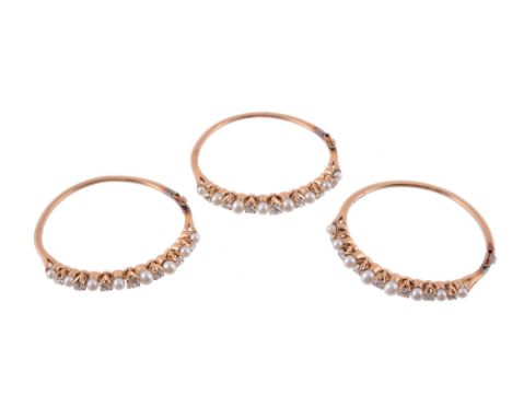Three diamond and pearl hinged bangles, each one set with alternating old...  Three diamond and pearl hinged bangles,   each 